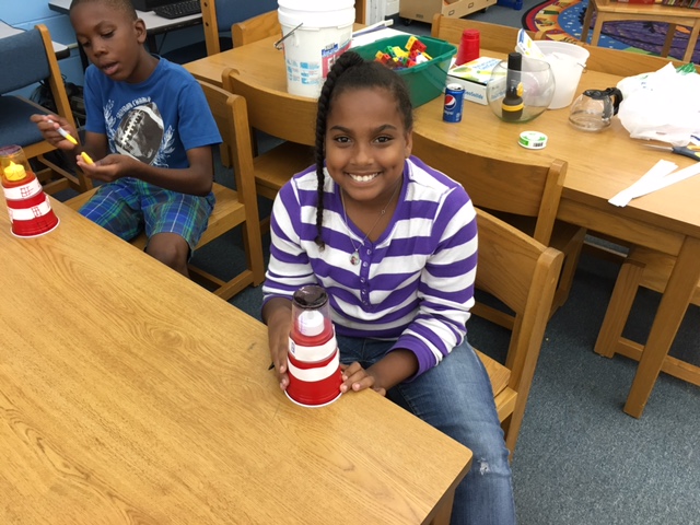 Student presenting a lighthouse